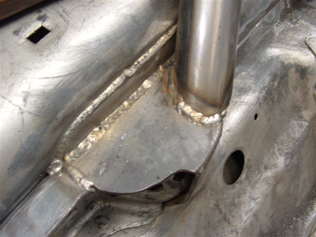 Terminates at the castor arm mounting point