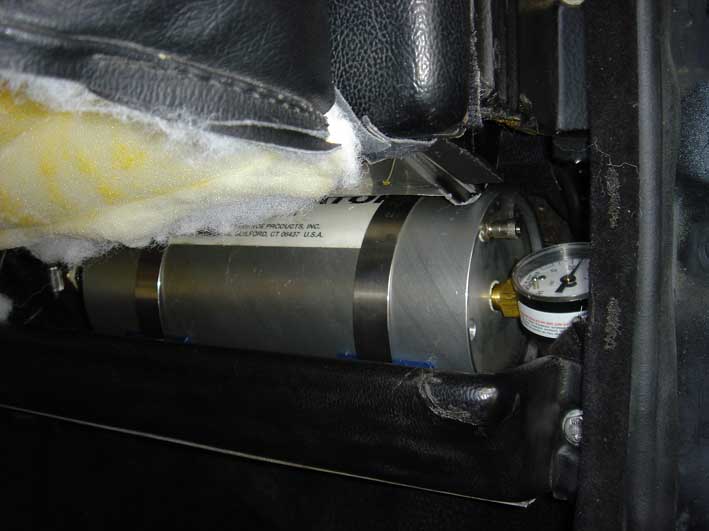 That's an acumilator that releases pressure into the oil system to feed the turbo's on start-ups and harsh situations.