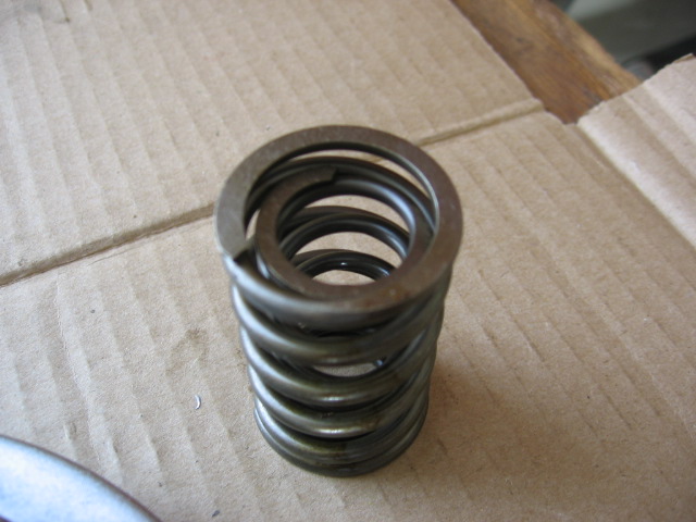 IAP springs have a sharp end and a 'cut?' end...end with cut fits bucket/retainer side better