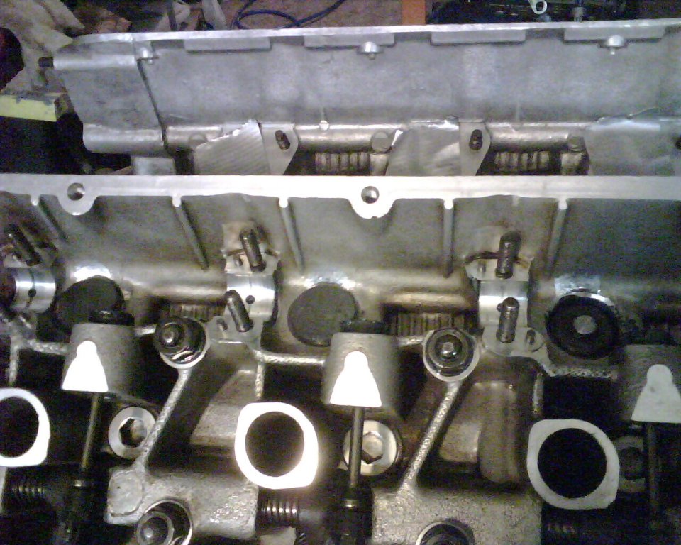 The shiney spots next to the intake tappets are where I made some clearance.