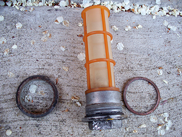 Left ring is the part that ripped free from the bottom of the tank, middle is the filter sleeve, right ring is the copper gasket.